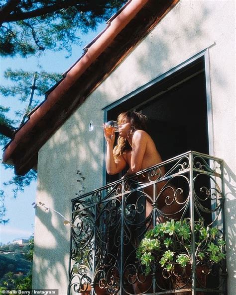 halle berry enjoyed a glass of wine in the nude.|Halle Berry, 56, strips fully naked and drinks wine on a balcony in ...